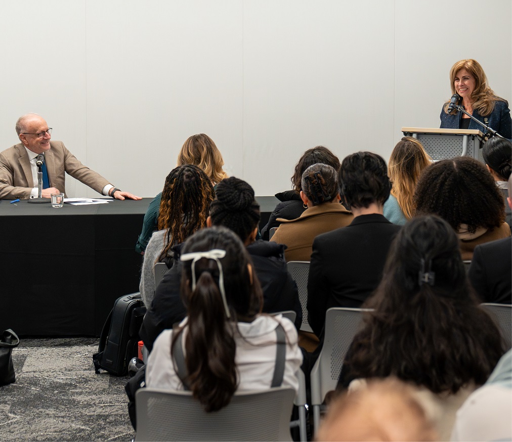 Justice Karakatsanis speaks at a podium in front of a group