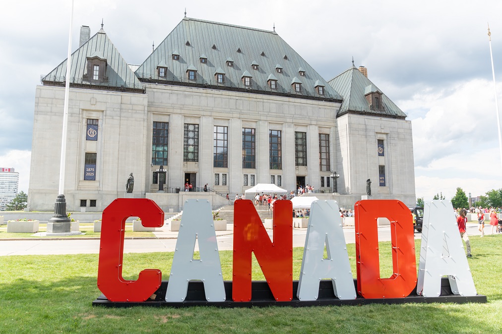 Large letters spelling CANADA on the front lawn of the Supreme Court building