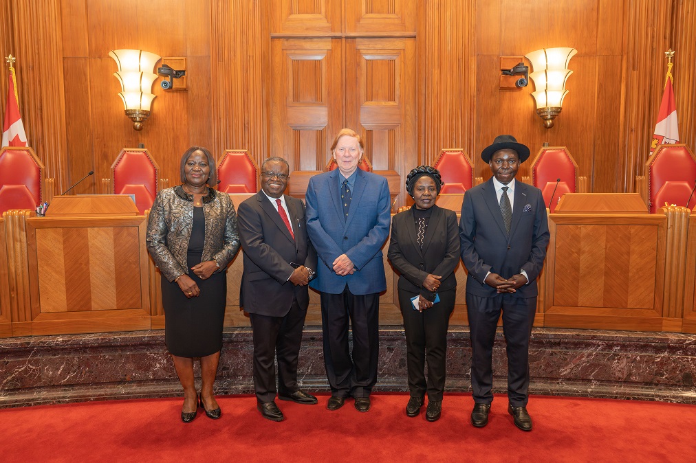 Justice Rowe with visiting judges in the main courtroom