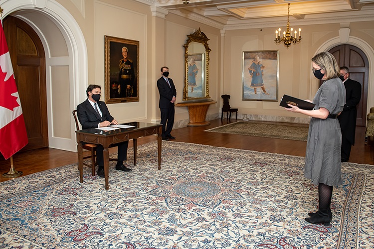 Chief Justice Wagner Richard Wagner signing a document