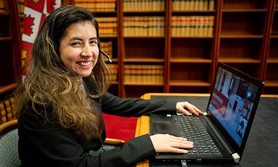 A tour interpreter at her computer